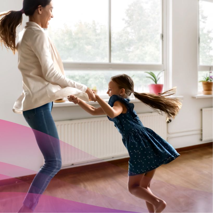 mother dancing inside with her daughter