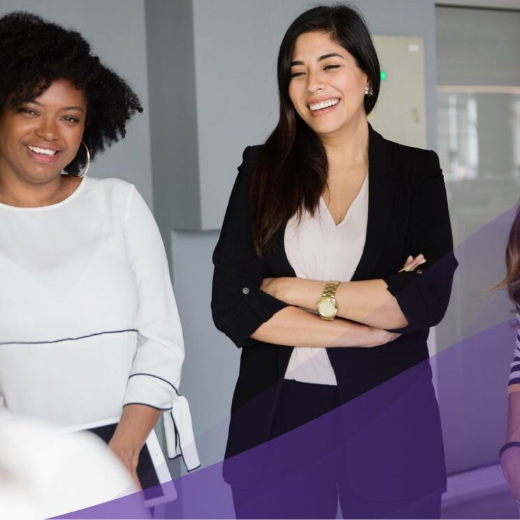 group of businesswomen smiling and laughing