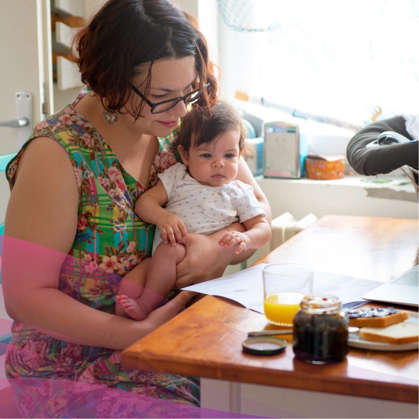 mother working with her baby on her lap
