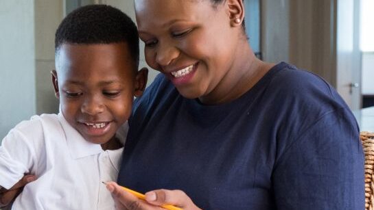 Mother helping son with homework
