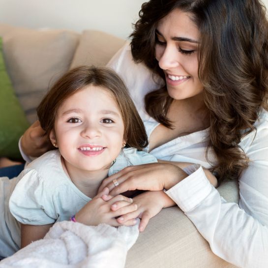 mother and daughter on the couch