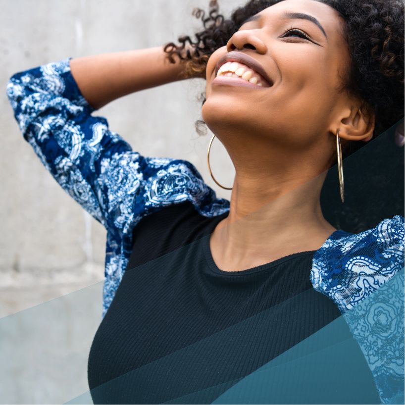 close up of woman smiling and celebrating