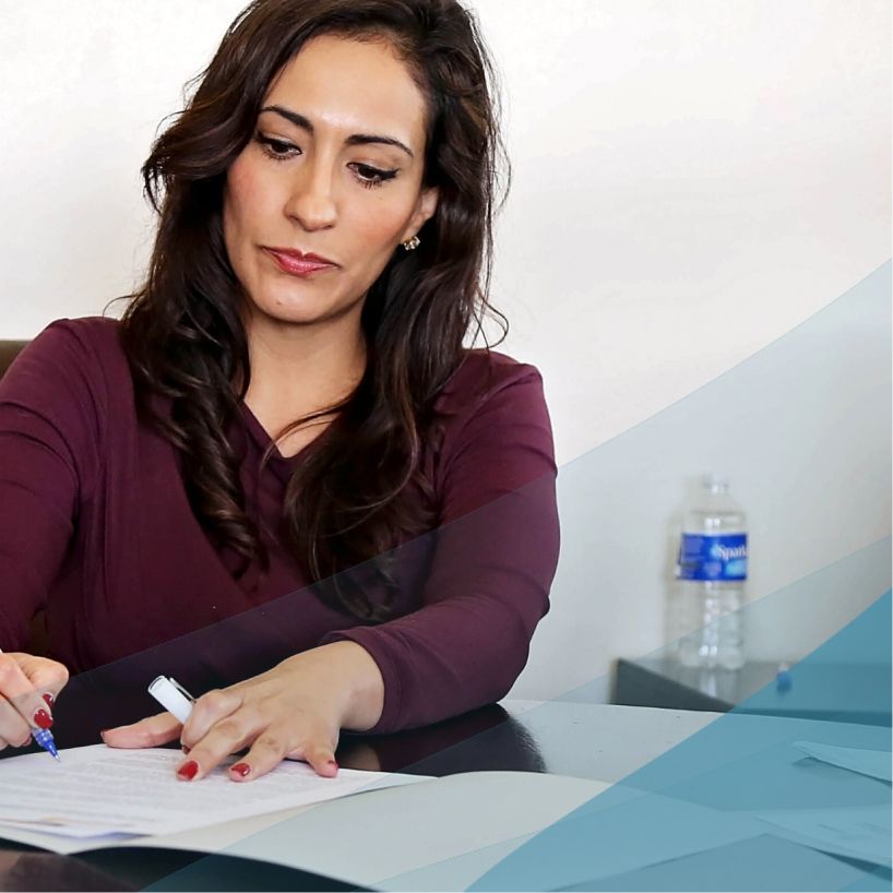 woman working and taking notes