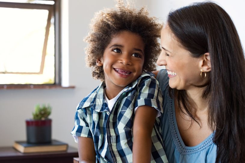 Woman smiling at her child