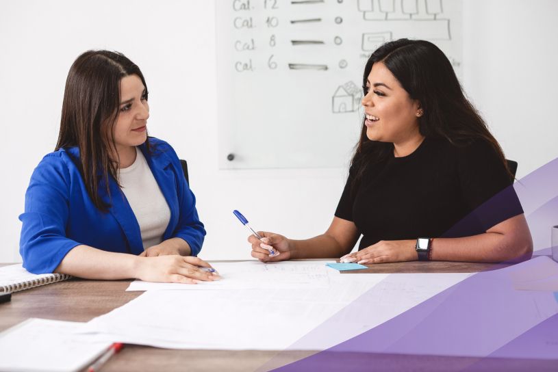 Two women studying together in classroom