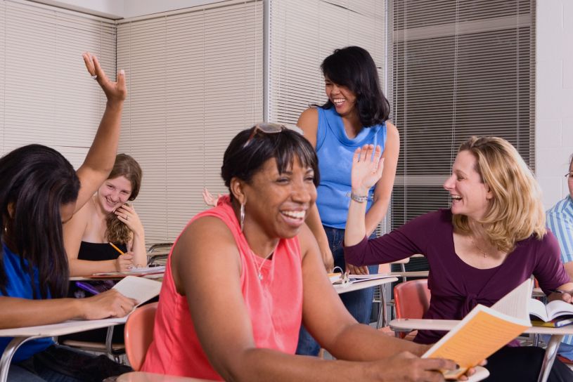 Literary classroom filled with smiling women