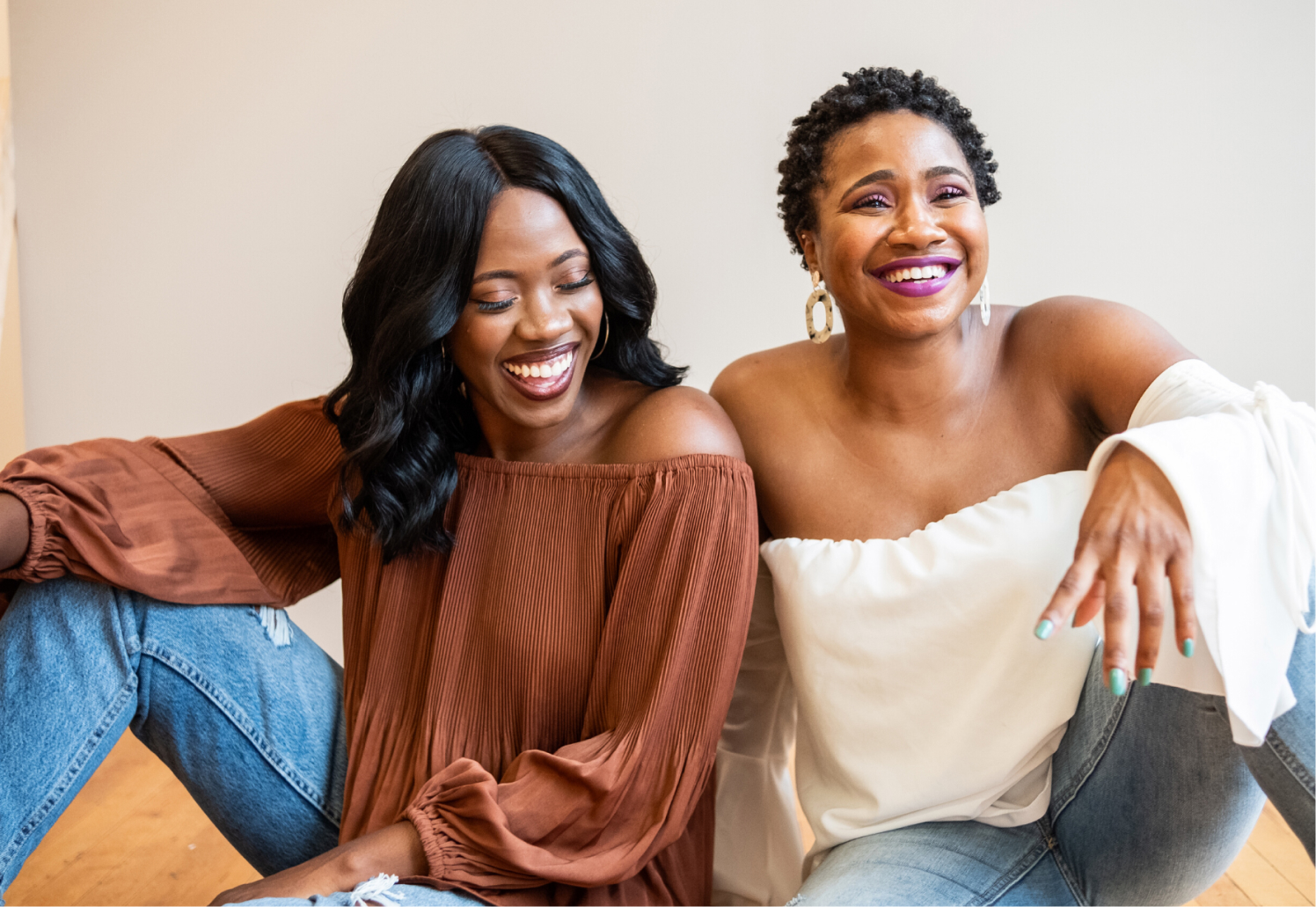 Two women happily sitting together
