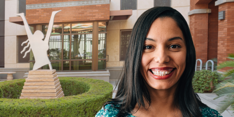 woman smiling in front of fresh start women's resource center